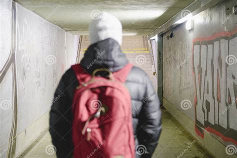 Person Walking In Subway Underpass Light At The End Of The Tunnel