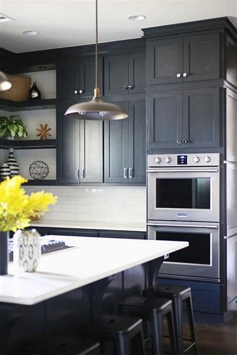 Shaker kitchen cabinets are a popular trend in current kitchen renovations because of the classic and simple look they give to either a traditional or contemporary design. A stainless steel dual oven is positioned beneath stacked ...
