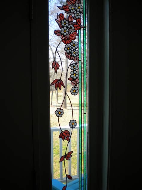 Painted Stained Glass On The Sidelight Windows Of The Front Door