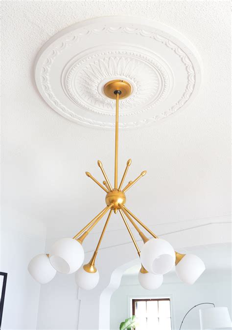 The lightweight, molded plastic medallion comes in a white finish. How to Center a Light Fixture Using a Ceiling Medallion ...