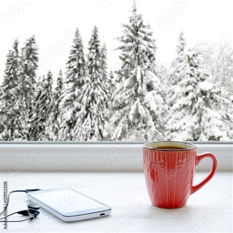 Cup Of Coffee Smartphone And Headphones On A Windowsill In The