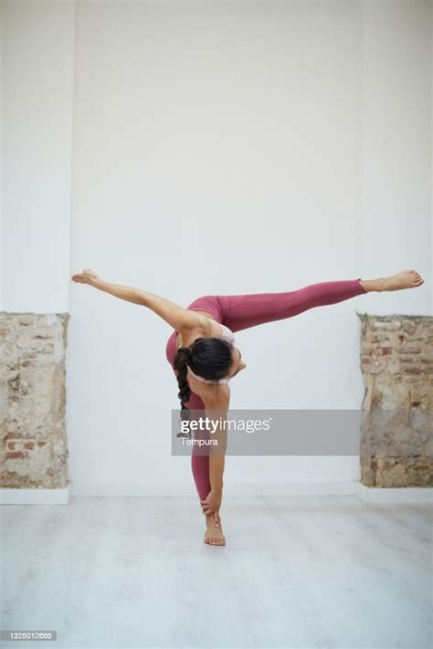 A Woman Doing Standing Splits Yoga Pose High Res Stock Photo Getty Images