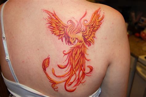 Phoenix Tattoo On Back Of Girls Shoulder In Fire Colors