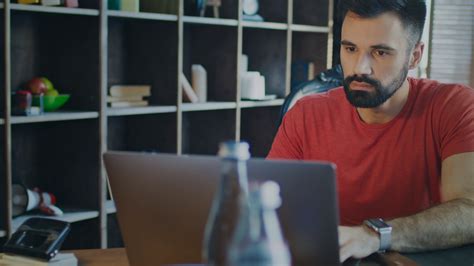 Beard Man Working Laptop Computer In Home Office Serious Man Looking