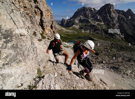 Climbers At A Via Ferrata Tour To Mt Paternkofel Hochpustertal