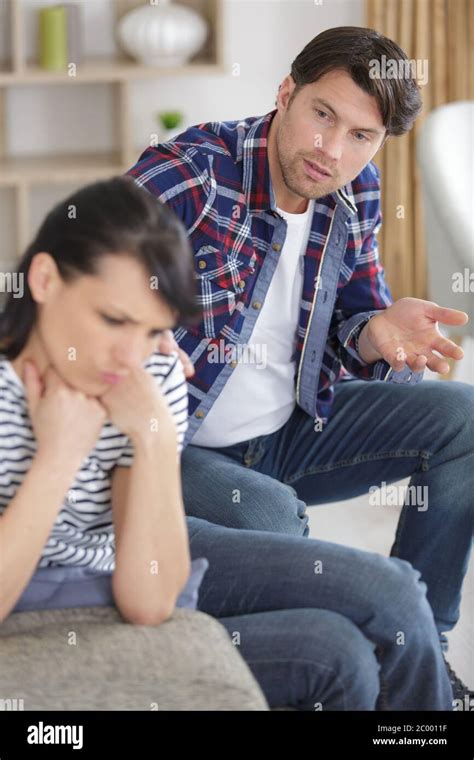 Man Asking For Forgiveness From Serious Woman Stock Photo Alamy