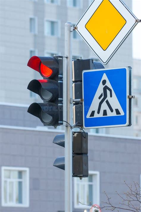 Red Traffic Light Pedestrian Crosswalk And Main Road Signs Stock Photo