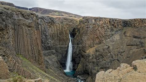 Henoss Waterfall With Basalt Column Formations Egilsstadir Iceland