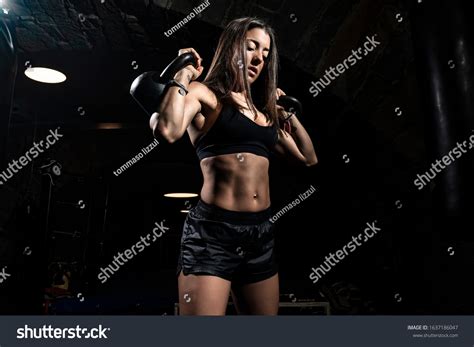 Strong Fitness Woman Bodybuilder Pumps Muscles Stock Photo