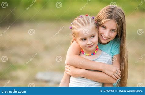Little Sisters Hugging Stock Photo Image Of Little 124920988