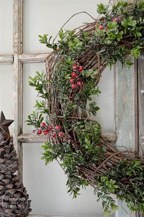 Anderson Grant Displaying A Christmas Boxwood Wreath Home For The
