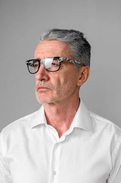 Premium Photo Elderly Grandpa Senior Man Wearing Optical Glasses On Grey Background Copy Space