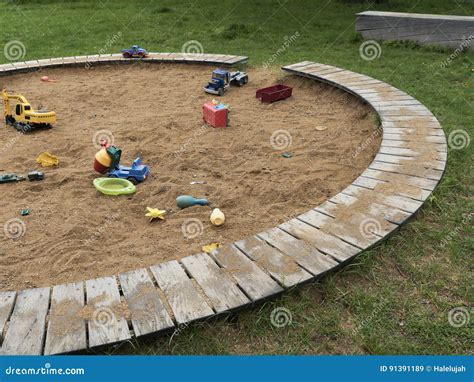 Children`s Playground With Sandbox And Toys Relaxation Park Familie