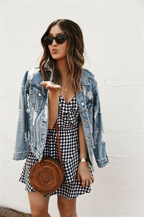 30 ways to effortlessly rock a denim jacket the denim jacket is essential to our wardrobes as