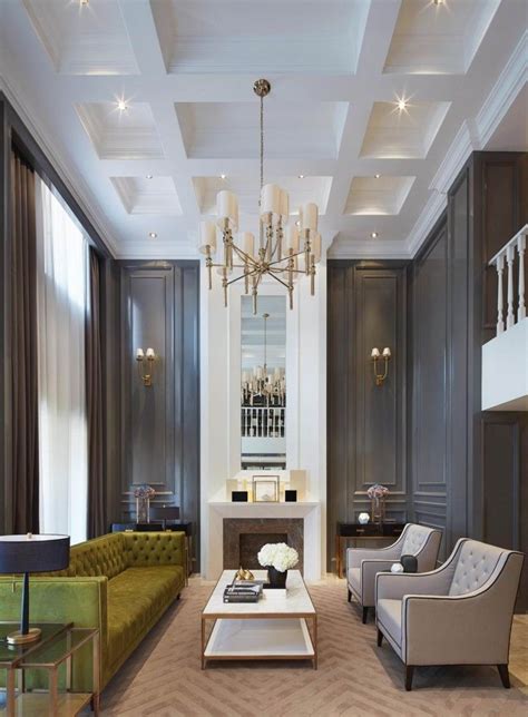 If you will be seeing living rooms that looks like a showroom of old designed living room set, formal but busy and showcase the finest designs. Gorgeous dark walls and high ceilings with minimal but ...