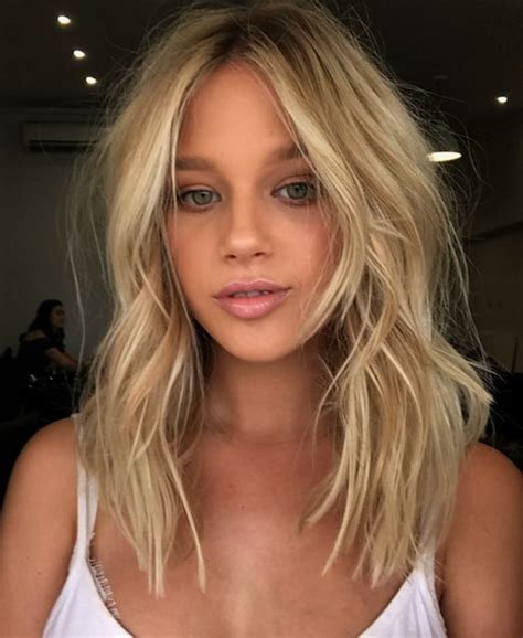 Curtain bangs are perfect for someone who wants bangs but doesn't want to have to wait to grow them out. 7 Biggest Haircut Trends in 2019 | Ecemella
