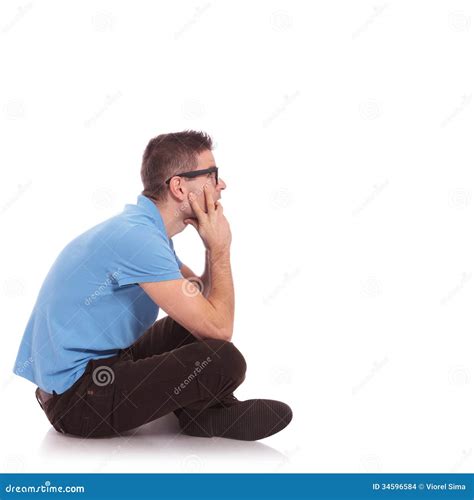 Side Of A Casual Man Sitting With Legs Crossed Stock Photo Image Of