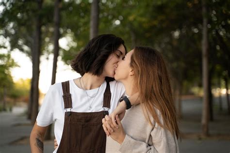 Free Photo Adorable Lesbian Couple Kissing Outdoors