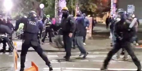 Video Rioter Hits Seattle Cop In Back Of Head With Metal Baseball Bat Explosives Thrown At