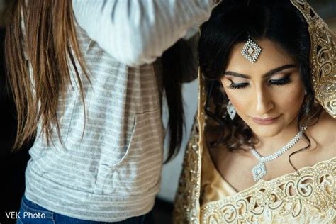 Hair And Makeup Artist Assisting The Beautiful Maharani Prior To The