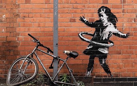 A Banksy Mega Collector Just Bought The Mural Of A Girl With A Hula