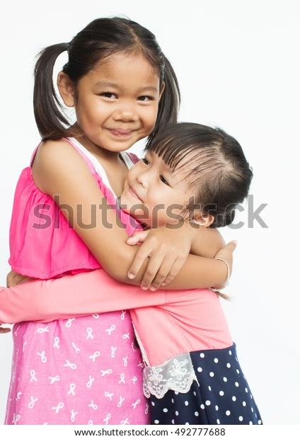 Young Adorable Asian Girls Hugging Each Stock Photo 492777688
