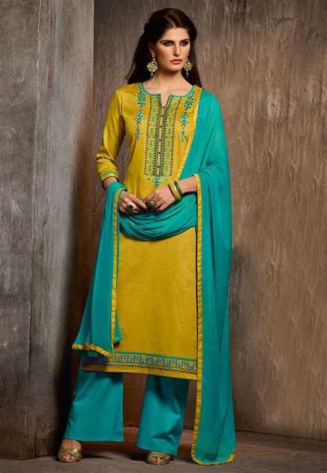 Poly Cotton Pakistani Suit In Mustard This Semi Stitched Accoutre Is