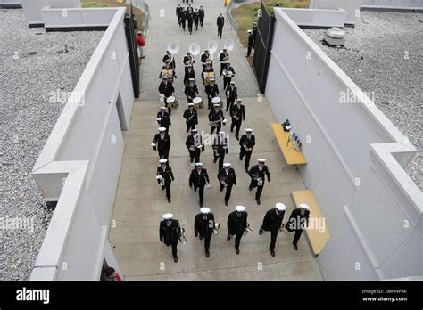 the naval academy band marches onto navy marine corps memorial stadium prior to an ncaa college