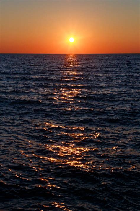 Lake Michigan Sunset The Setting Sun Shines Across The Waters Of Lake