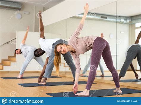 Woman Doing Revolved Wide Legged Forward Bend Pose Stock Image Image