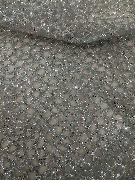Silver Glitter Fabric With Circles On It