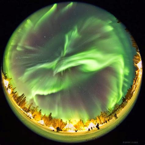 Dazzling Displays Of Aurora Borealis Dance Across The Night Sky Snow