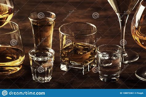 selection of hard strong alcoholic drinks in big glasses and small shot glass in assortent