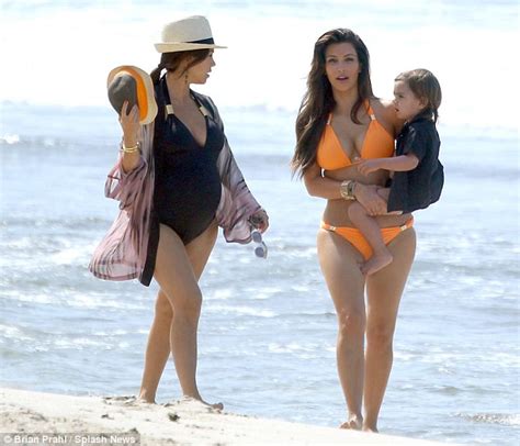 Kim Kardashian Heats Up The Mexican Beach In An Eye Catching Orange