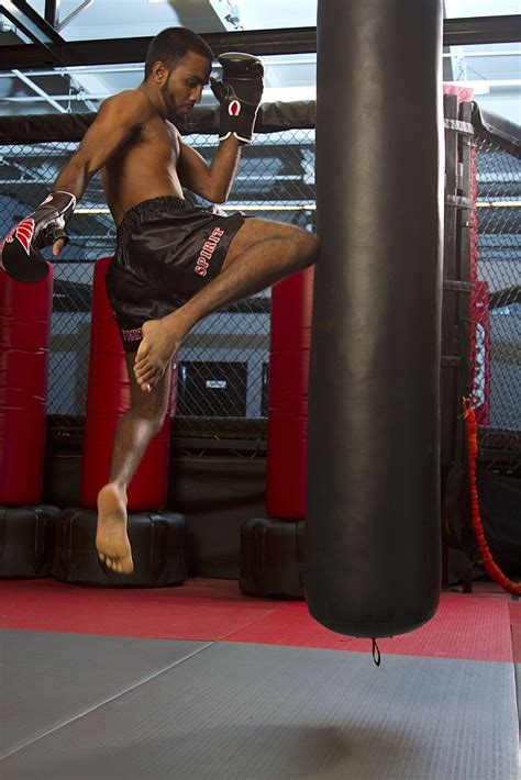 Pro Muay Thai World Champion Andy Singh Practicing A Flying Knee In