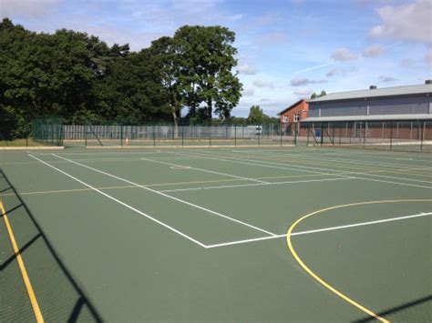 It is a firm rectangular surface with a low net stretched across the centre. Tennis Court Line Marking