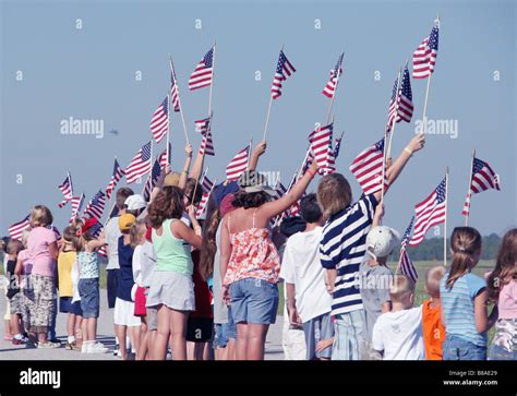 Group Of Young Patriotic Children Waving American Flags Stock Photo Alamy