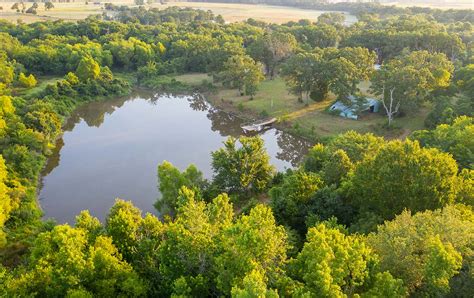 The 38x48 workshop has electricity, double insulated doors and plumbing that has to be hooked up, walls are 11ft & peak of building is 13ft. Windham Ranch - Texas Ranch Sales, LLC