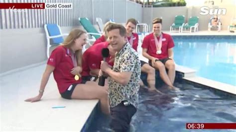 bbc reporter falls into pool while interviewing british swim team the courier mail