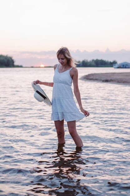 Premium Photo A Young Woman Is Standing In The Water A Beautiful