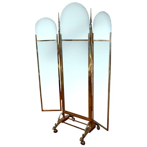 Dimensions 100cm l x 3cm w x 180cm h. 3 Panel Old Brass Cheval Mirror on Wheels at 1stdibs