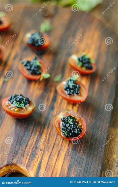 Wooden Board With The Black Caviar Appetizers Stock Photo Image Of