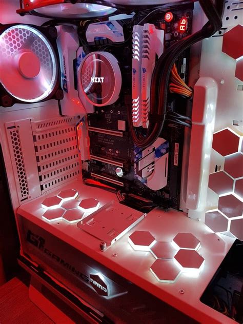 The Inside Of A Computer Case With Red And White Lights On Its Sides