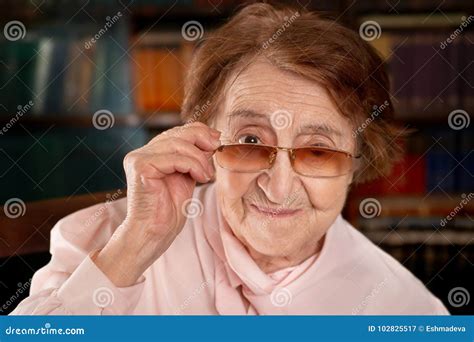 Senior Smiling Woman Looking Over The Glasses Stock Image Image Of