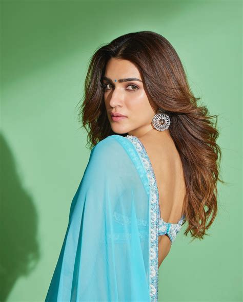 kriti sanon s sizzling hot avatar in a blue saree with backless blouse see photos and videos