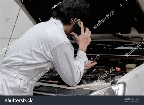 Side View Automotive Repairman Uniform Talking Stock Photo 683101294
