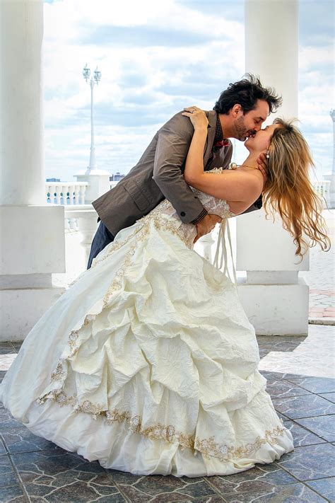 Royalty Free Photo Man And Woman Kissing Near White Concrete Pillar