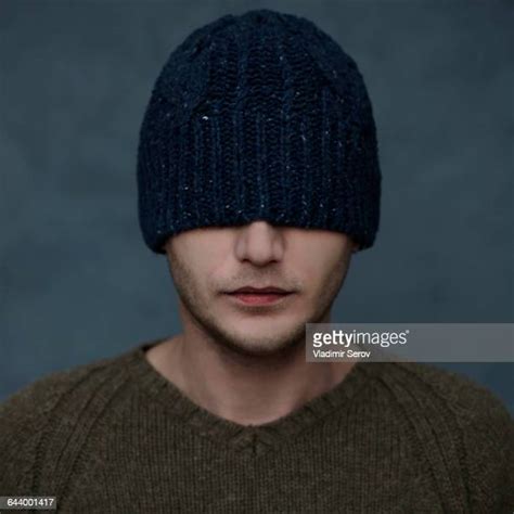 Man Covering Face With Hat Photos And Premium High Res Pictures Getty