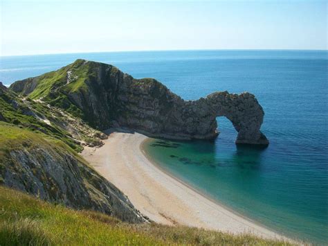 The Famous Durdle Door Is A Natural Limestone Arch On The Jurassic