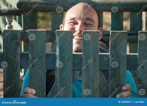 Happy Man Behind Fence Stock Image Image Of Smile Bald 42309621
